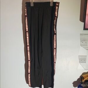 Men’s Jordan Black Track Pants. Buttons all the way down. Mens size Medium.